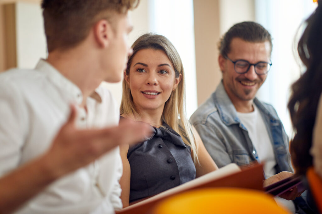 Business people talking at a meeting in a pleasant atmosphere in a conference hall. People, job, company, business concept.
